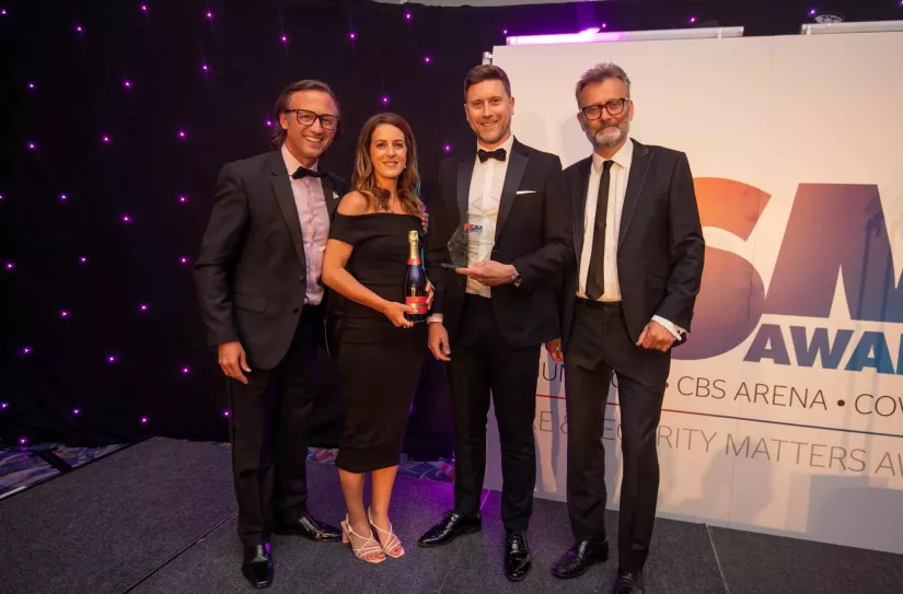 Frances Edwards and Tom Clarke accept award for 'Security Installation Company of the Year' at the 2023 FSM Awards in Coventry, UK.