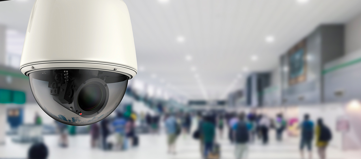 Security camera on shopping area ceiling