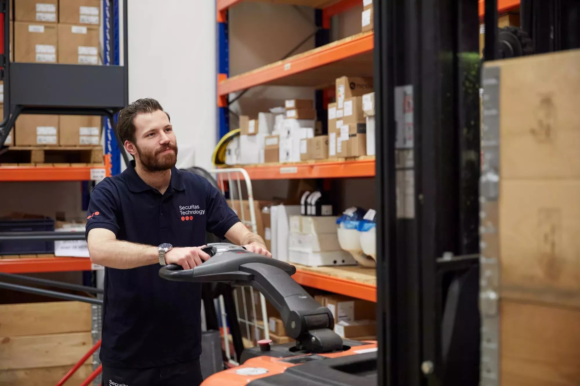 Employee in warehouse equipped with electronic security 