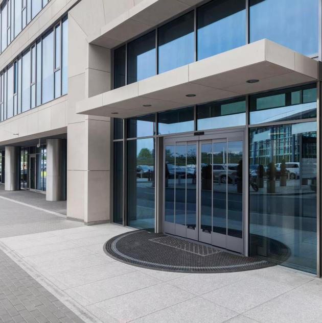 Closeup of a glass entrance to office building