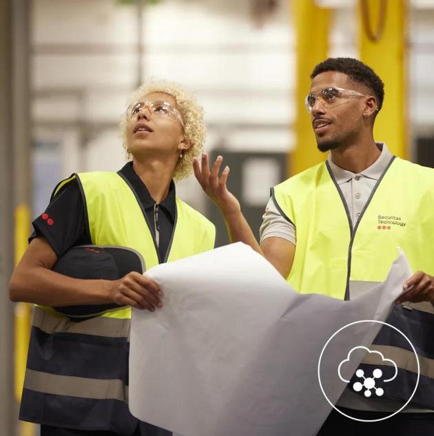 security technicians surveying a warehouse for security solutions 