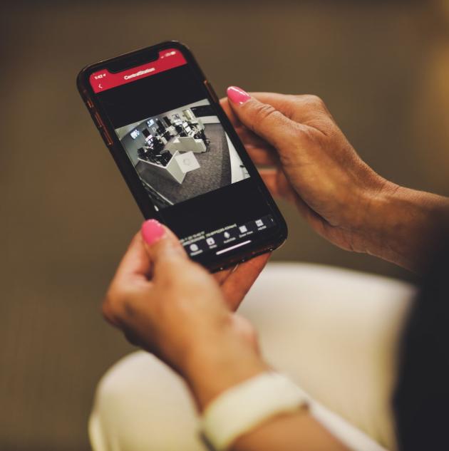 woman on phone reviewing video