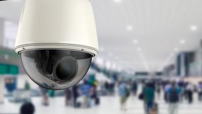 Security camera on shopping area ceiling