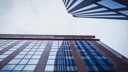 Buildings outside looking up toward sky